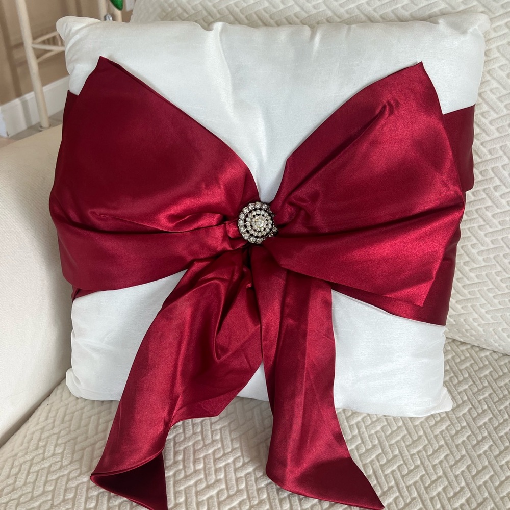 White Holiday Pillow with red bow